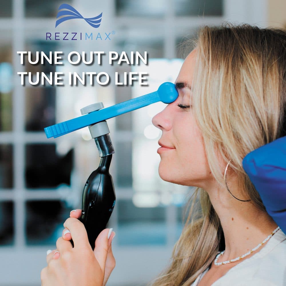 Rezzimax Tuner Pro in use — handheld vagus nerve stimulation device